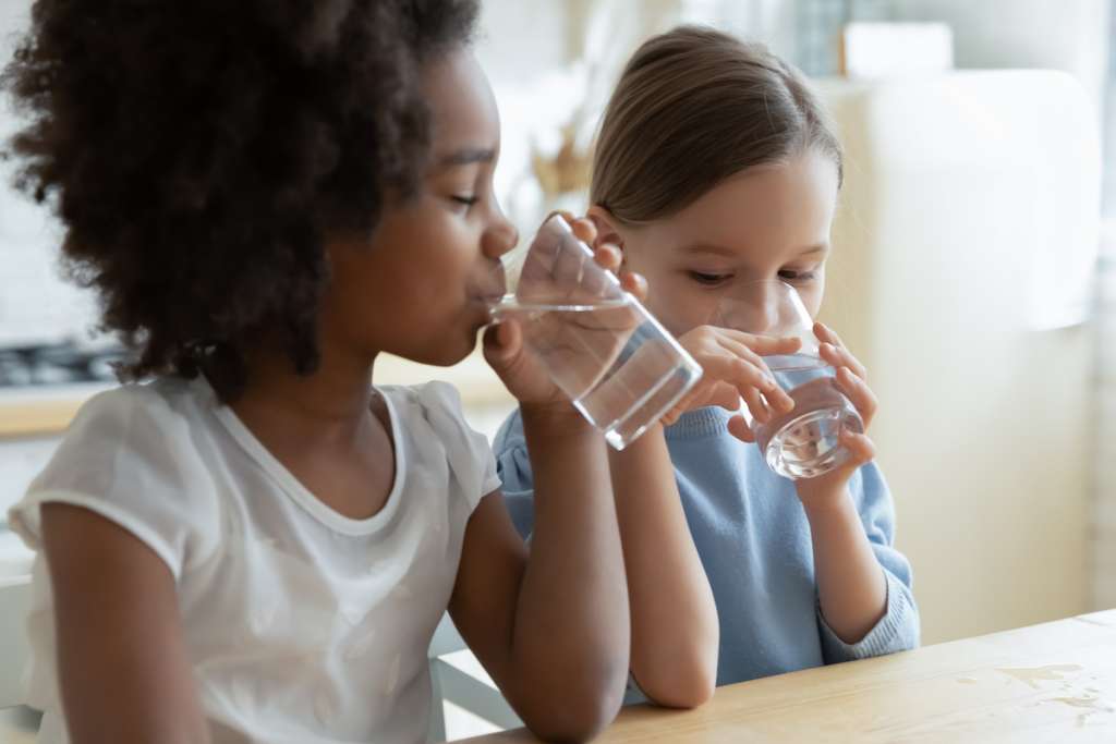 is water filtration worth it-little girls drinking water
