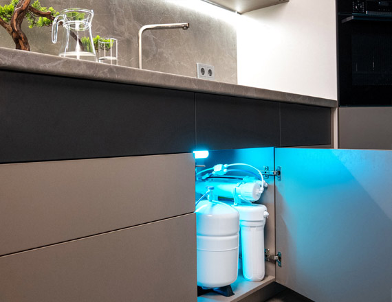 Metro Water Filter's chlorinator equipment under the kitchen sink