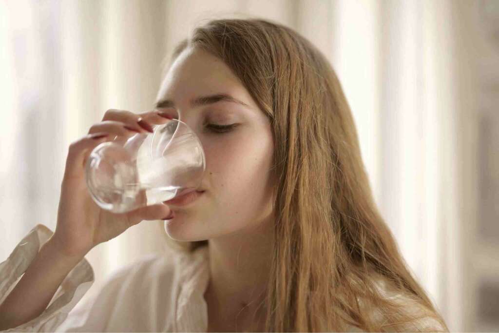 A lady drinking clean water