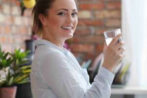 Woman smiling and relieved that her water free from PFAS