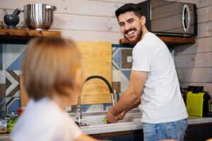Couple happily discussing water filtration installations that qualify for tax benefits