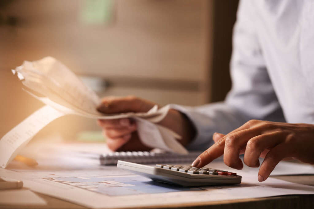 A person calculating tax deductions for home renovations
