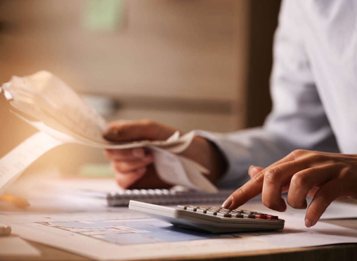 A person calculating tax deductions for home renovations