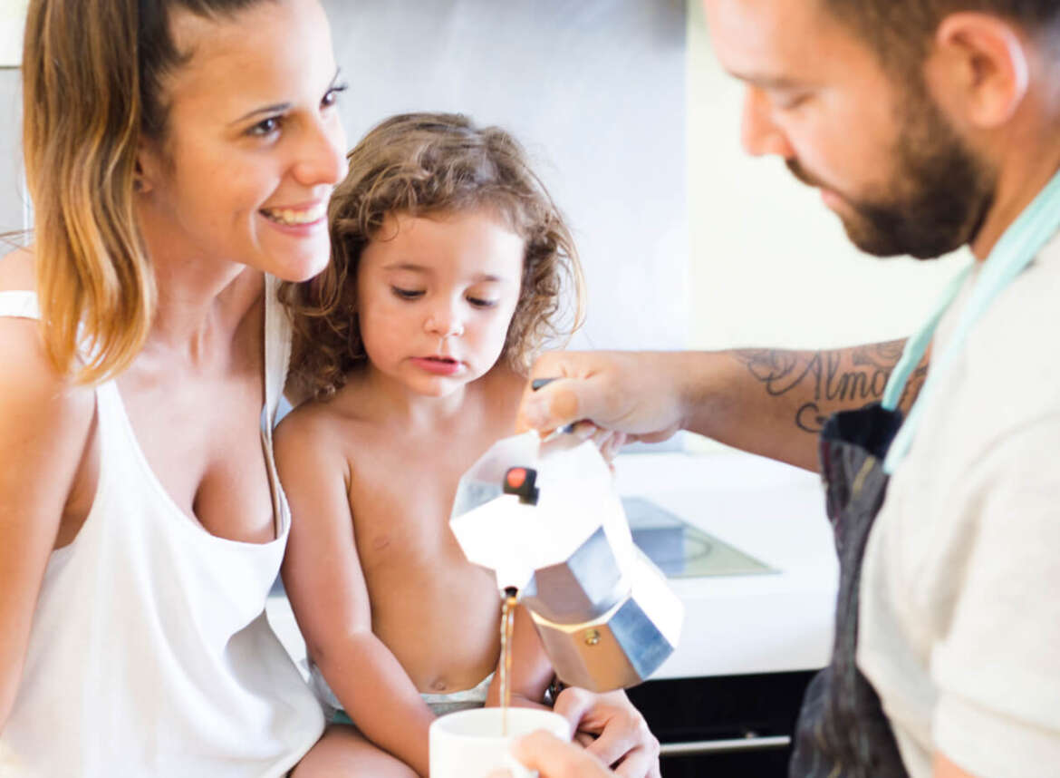 A couple and their child enjoying their quality-tested water