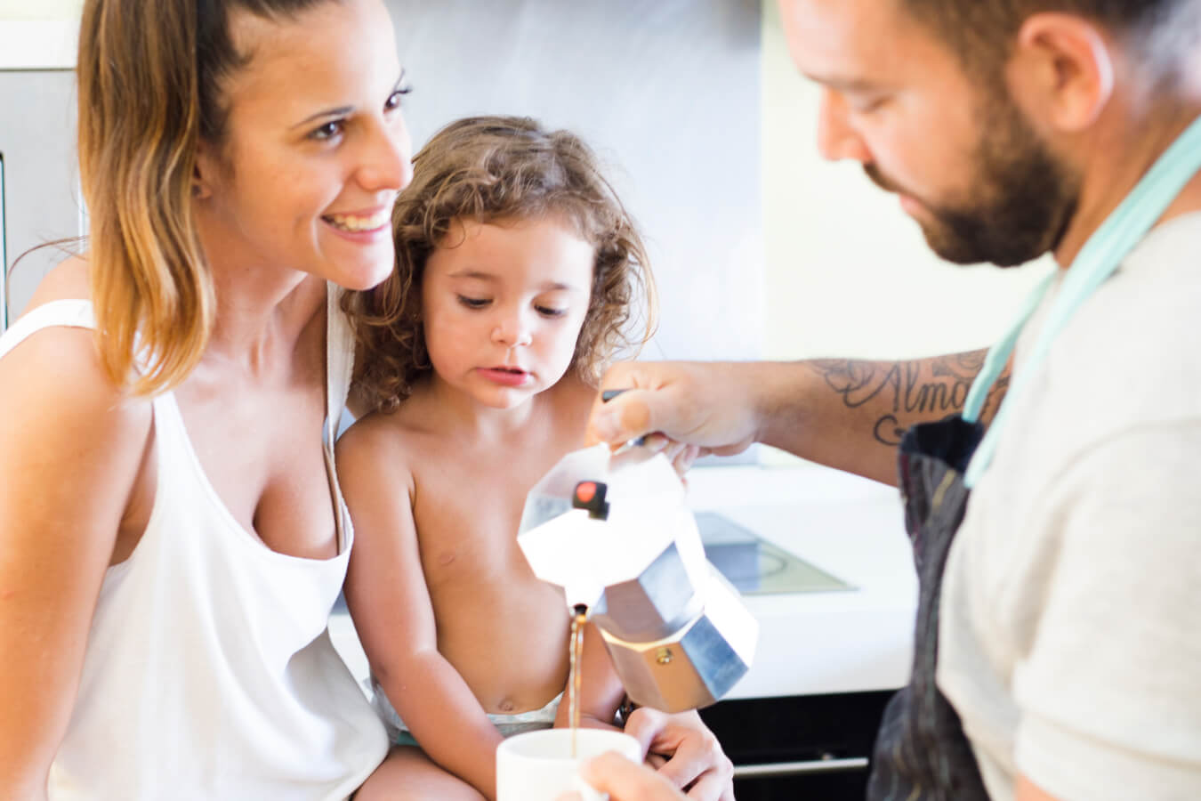 A couple and their child enjoying their quality-tested water