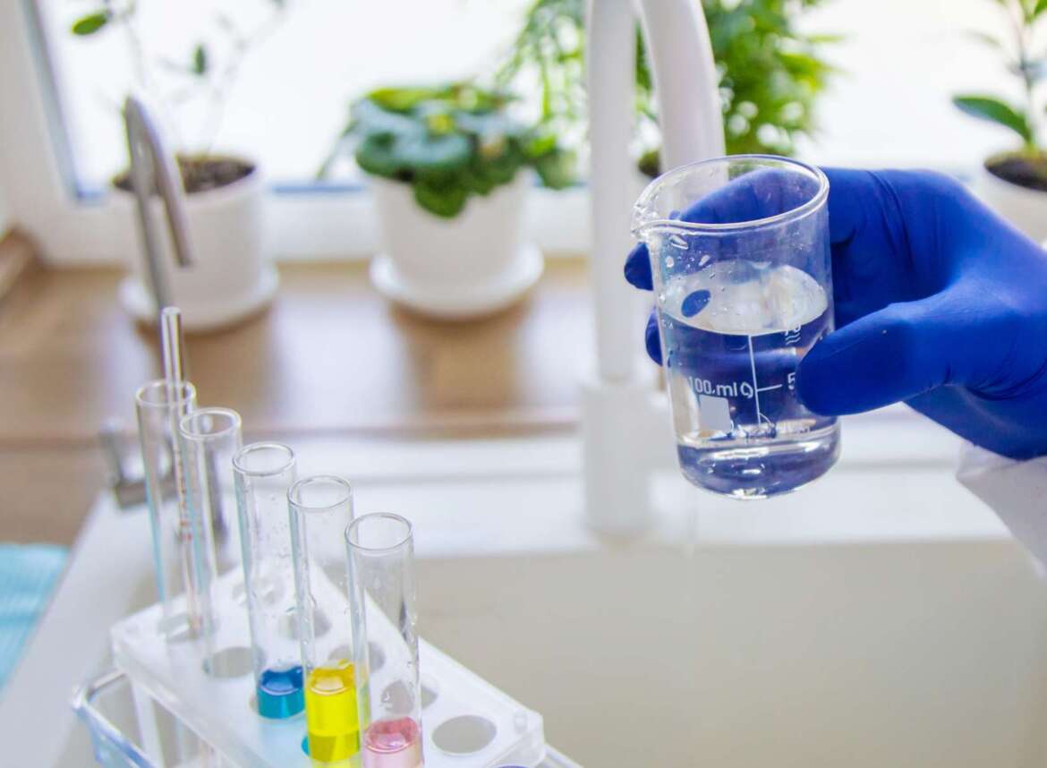 Water filtration expert performing professional water quality test