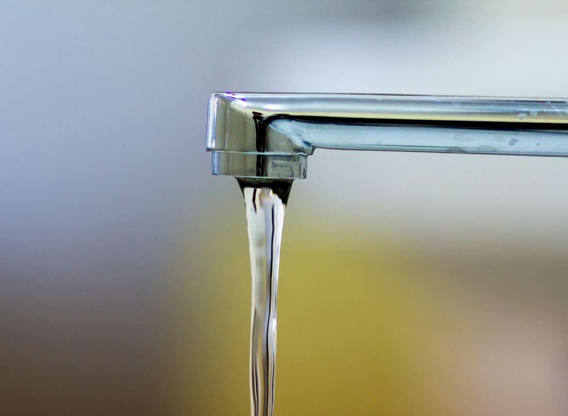 Running water from a faucet